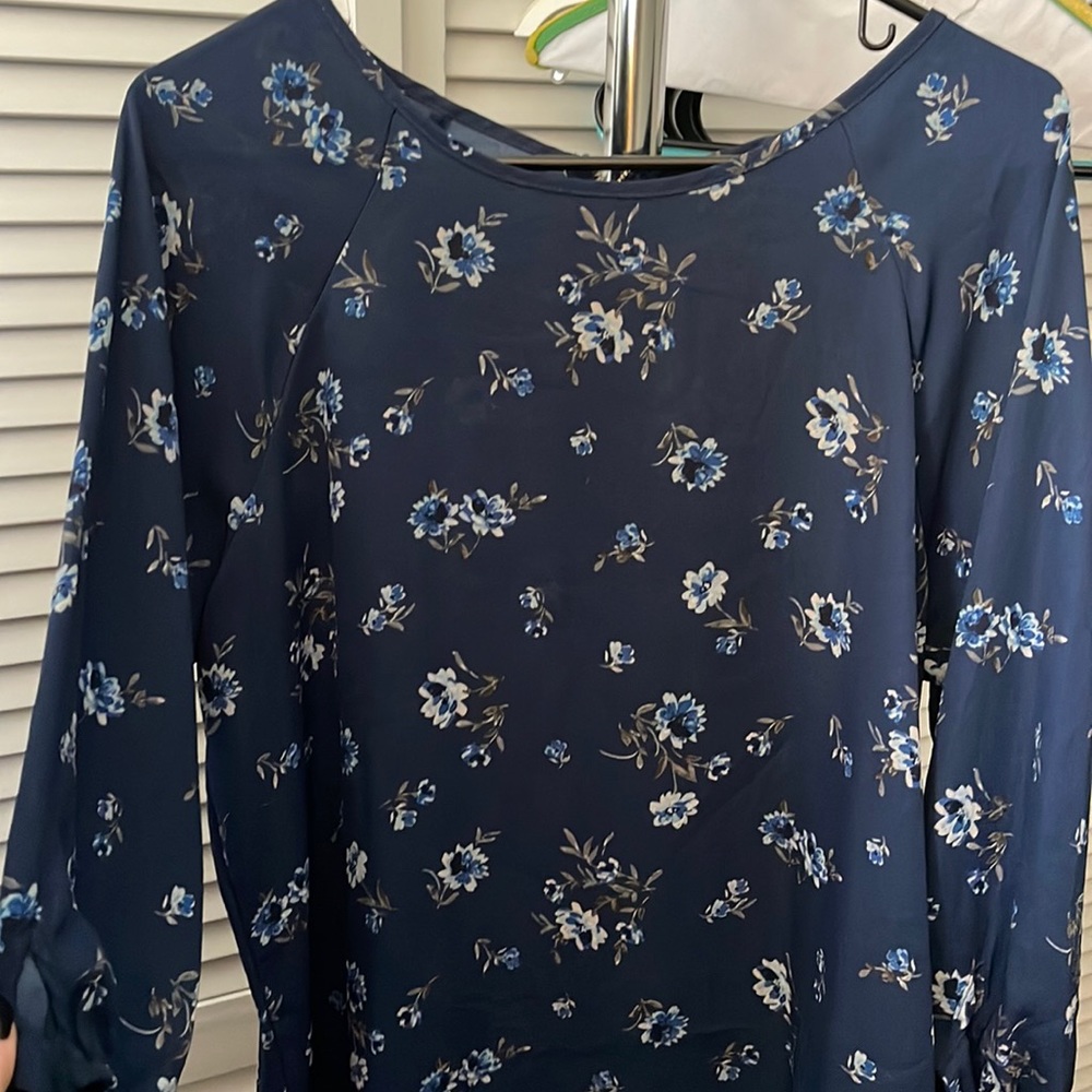Dark blue flowery blouse, size large.